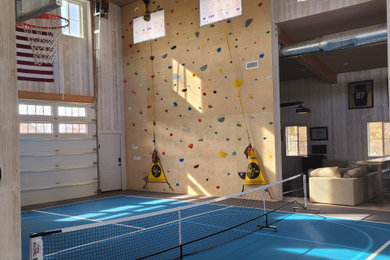Example of a large concrete floor and vaulted ceiling indoor basketball/tennis/multi-game court design in Salt Lake City with white walls