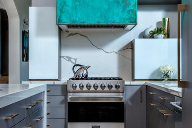Inspiration for a mid-sized contemporary beige floor kitchen remodel in Phoenix with flat-panel cabinets, gray cabinets, granite countertops, white backsplash, stainless steel appliances and white countertops