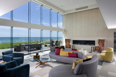 Living room - huge contemporary open concept living room idea in New York with beige walls and a ribbon fireplace