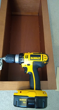 Attaching face frame of diagonal corner cabinet to straight cabinet ...