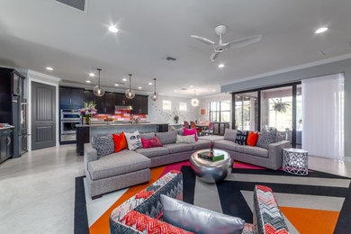 Example of a large transitional open concept porcelain tile living room library design in Tampa with gray walls, a ribbon fireplace, a tile fireplace and no tv