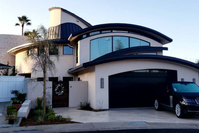 Inspiration for a contemporary three-story exterior home remodel in San Diego with a metal roof