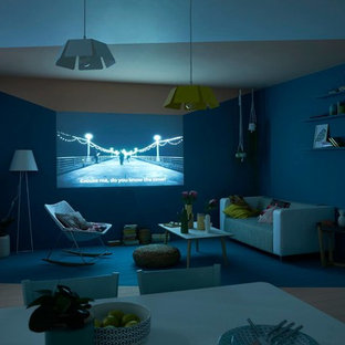 Design ideas for a medium sized scandi home cinema in Paris with blue walls, painted wood flooring and a projector screen.