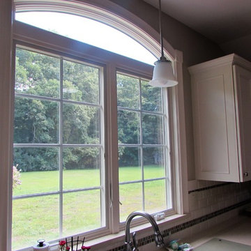 Large Arched Anderson Window With View of Yard