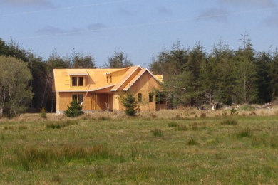 Example of a country home design design in Other