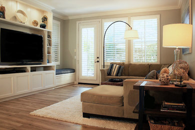 Family room - mid-sized contemporary porcelain tile family room idea in Orange County with gray walls and a tv stand
