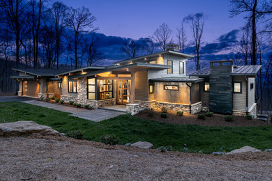 Example of a mid-sized mountain style exterior home design in Other