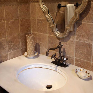 Gold Rope Border Painted Sink in Beige Stone Bathroom