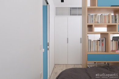 Inspiration for a small contemporary loft-style light wood floor bedroom remodel in Hong Kong