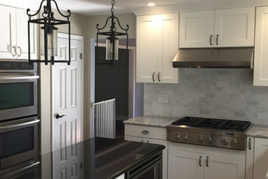 Example of a transitional kitchen design in New York