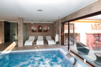 Pool fountain - small contemporary indoor rectangular pool fountain idea in Other