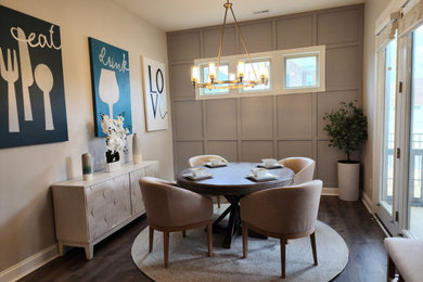 Small transitional dark wood floor, brown floor and wood wall breakfast nook photo in Charlotte with blue walls and no fireplace