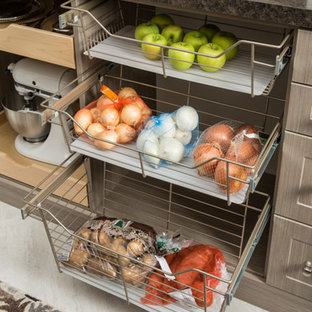 Mid-sized transitional kitchen pantry photos - Kitchen pantry - mid-sized transitional l-shaped ceramic floor and white floor kitchen pantry idea in Burlington with raised-panel cabinets, white cabinets, granite countertops, stainless steel appliances and no island