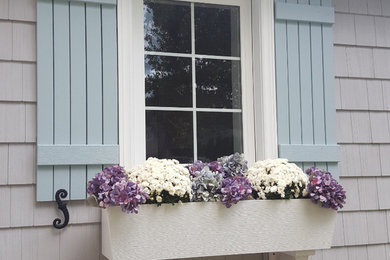 Mid-sized coastal gray one-story vinyl house exterior idea in Other with a shingle roof