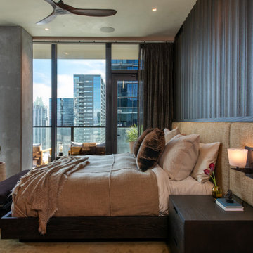 Proper Vibes Penthouse Primary Bedroom with Custom Oak Bed Wall