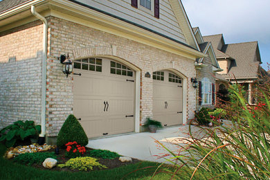 Garage - mid-sized craftsman attached two-car garage idea in Orange County