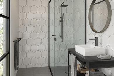 Design ideas for a contemporary 3/4 bathroom in Melbourne with open cabinets, a corner shower, white tile, a vessel sink, grey floor, a hinged shower door and black benchtops.