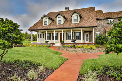 Huge rustic two-story stone exterior home idea in Other with a shingle roof