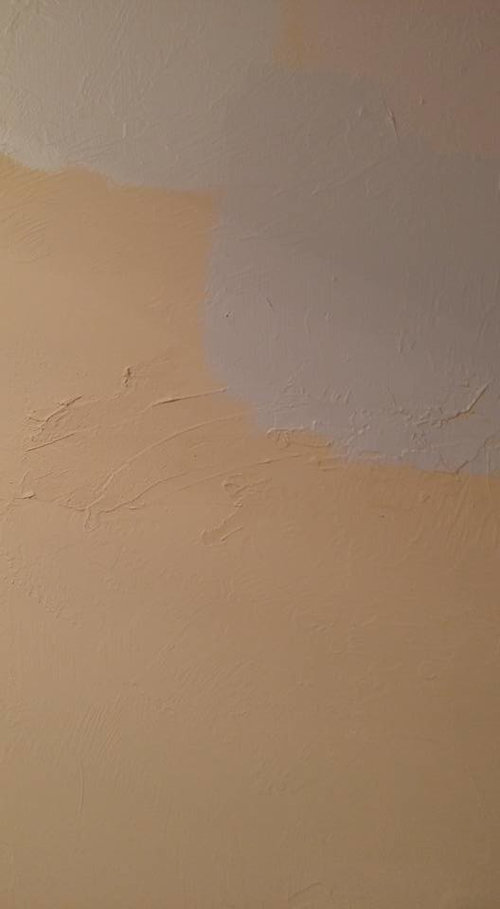 How to fix bad repairs on textured drywall?