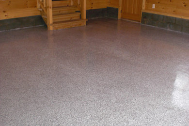 Mid-sized mountain style attached two-car garage photo in Other