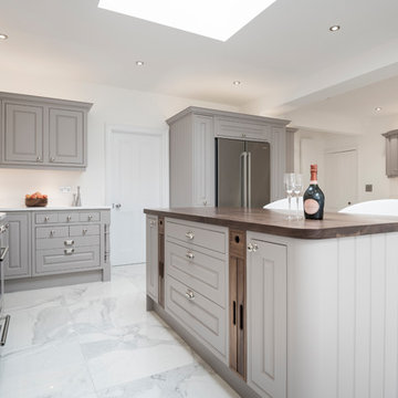 Upcycled grey kitchen with quartz and walnut surfaces
