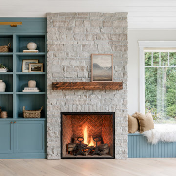 Modern Heritage Living Room with Limestone Fireplace and Built-In Shelving – Vic