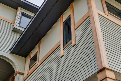 Inspiration for a mid-sized contemporary green two-story wood exterior home remodel in Nashville