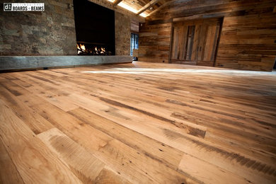 Oak Flooring with Hand Hewn Beams and Mixed Hardwood Paneling