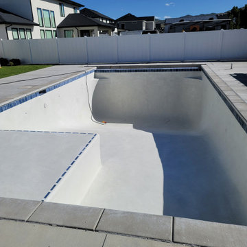 WHITE PLASTER BLUE TILE