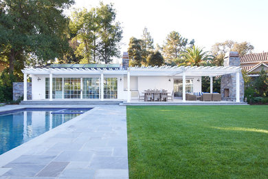 Pool house - small transitional backyard stone and rectangular pool house idea in San Francisco