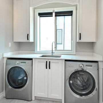 Modern laundry room with shaker style cabinets Vancouver