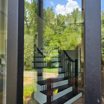 Project #130 | Curved Staircase with Wraparound Balcony