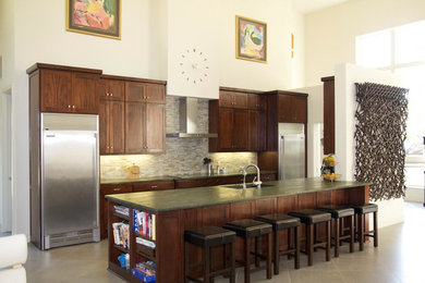 Large minimalist single-wall porcelain tile and gray floor open concept kitchen photo in Dallas with an undermount sink, shaker cabinets, dark wood cabinets, granite countertops, multicolored backsplash, porcelain backsplash, stainless steel appliances, an island and green countertops