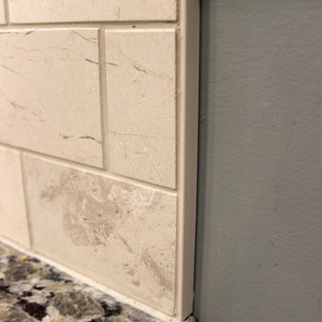 Beige Kitchen with Extra Large Island, Tile Backsplash and Granite Countertops