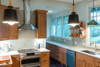Inspiration for a small craftsman kitchen remodel in Other with recessed-panel cabinets and an island