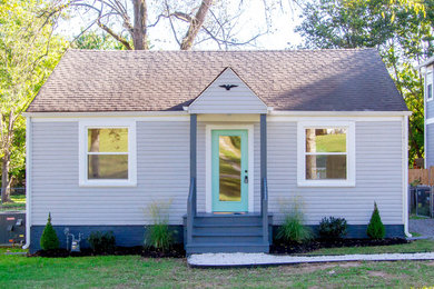 Example of a small minimalist gray one-story concrete fiberboard exterior home design in Nashville with a shingle roof