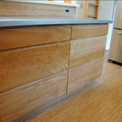 A new island allowed for more prep and storage space. - Kitchen Cabinetry