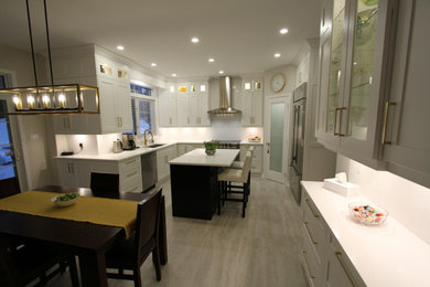 Inspiration for a large contemporary u-shaped porcelain tile and gray floor eat-in kitchen remodel in Toronto with an undermount sink, recessed-panel cabinets, white cabinets, quartz countertops, white backsplash, quartz backsplash, stainless steel appliances, an island and white countertops