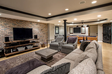 This is an example of a transitional enclosed family room in Chicago with a game room, grey walls, light hardwood floors and a freestanding tv.