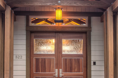 Inspiration for a large craftsman beige two-story concrete fiberboard exterior home remodel in Seattle with a shingle roof