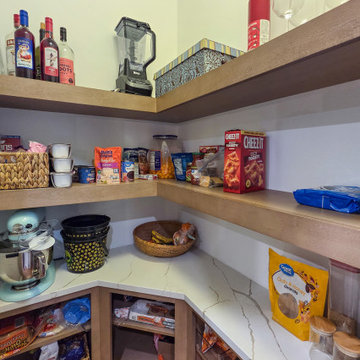 Walk-In Pantry with Quartz Countertops and Open Wood Shelving