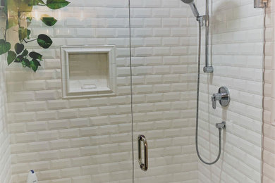 Example of a mid-sized beach style master white tile and subway tile bathroom design in Other with a one-piece toilet, yellow walls, a hinged shower door and a freestanding vanity