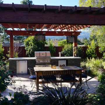 BBQ and Table under Arbor