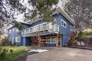 Inspiration for a large modern blue two-story wood exterior home remodel in Boise