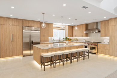 Huge l-shaped porcelain tile and gray floor eat-in kitchen photo in San Diego with a single-bowl sink, flat-panel cabinets, light wood cabinets, quartz countertops, beige backsplash, glass tile backsplash, stainless steel appliances, an island and beige countertops