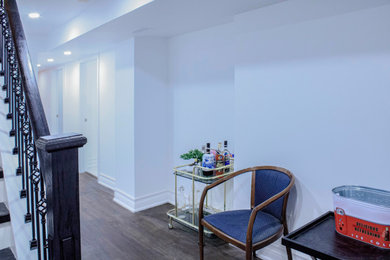 Inspiration for a vinyl floor and brown floor entryway remodel in Toronto with white walls