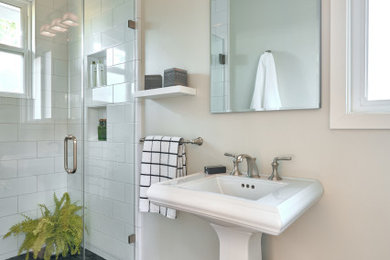 Example of a small trendy kids' white tile and ceramic tile porcelain tile, black floor and single-sink alcove shower design in San Francisco with white cabinets, a one-piece toilet, white walls, a pedestal sink, a hinged shower door, a niche and a freestanding vanity