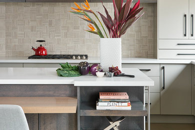 Inspiration for a large modern u-shaped medium tone wood floor and gray floor open concept kitchen remodel in Toronto with an undermount sink, flat-panel cabinets, beige cabinets, quartz countertops, beige backsplash, marble backsplash, paneled appliances and an island