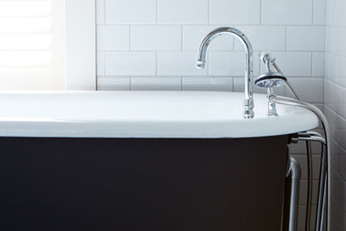 Trendy black and white tile and ceramic tile multicolored floor claw-foot bathtub photo in Nashville