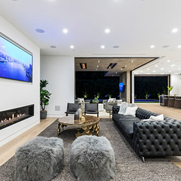 Open Concept Beverly Hills Living Room with Fireplace and Modern Seating